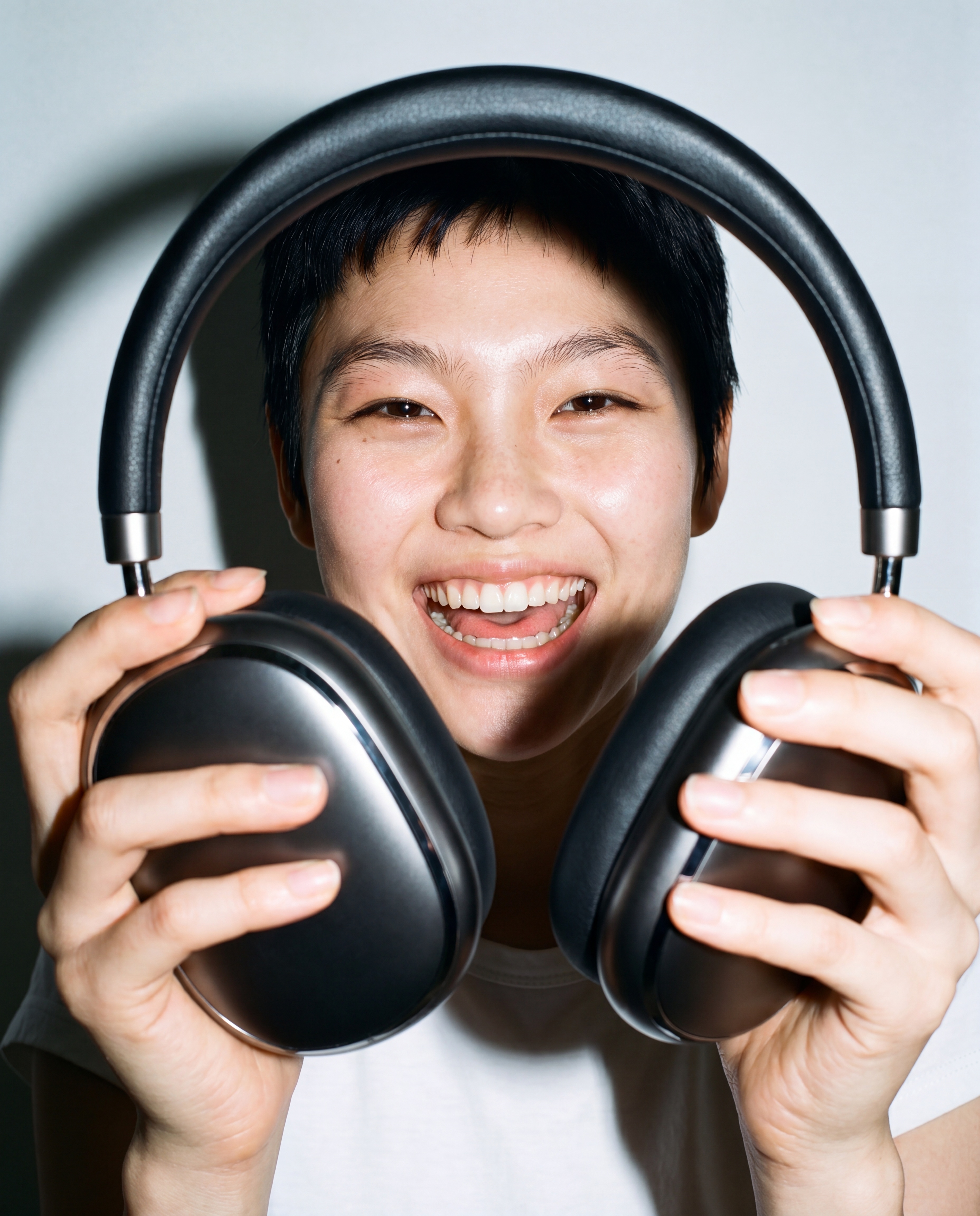 Sounds headphones being handed to another person